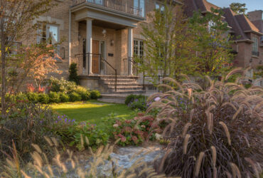 Beautiful view of the front of a home with nice landscaping