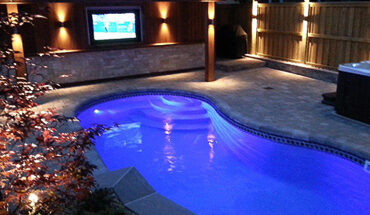 Great pool., lighting and outdoor tv in beautifully landscaped backyard